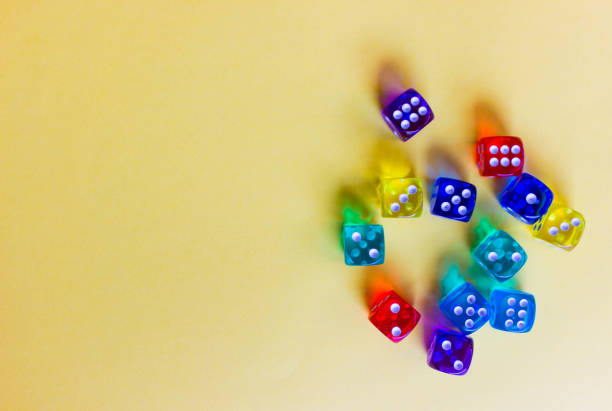 istock colored  dices showing different numbers on colored background. Free copy space. Concept of game, winning combination. Colored playing cubes. Top view 1222014819