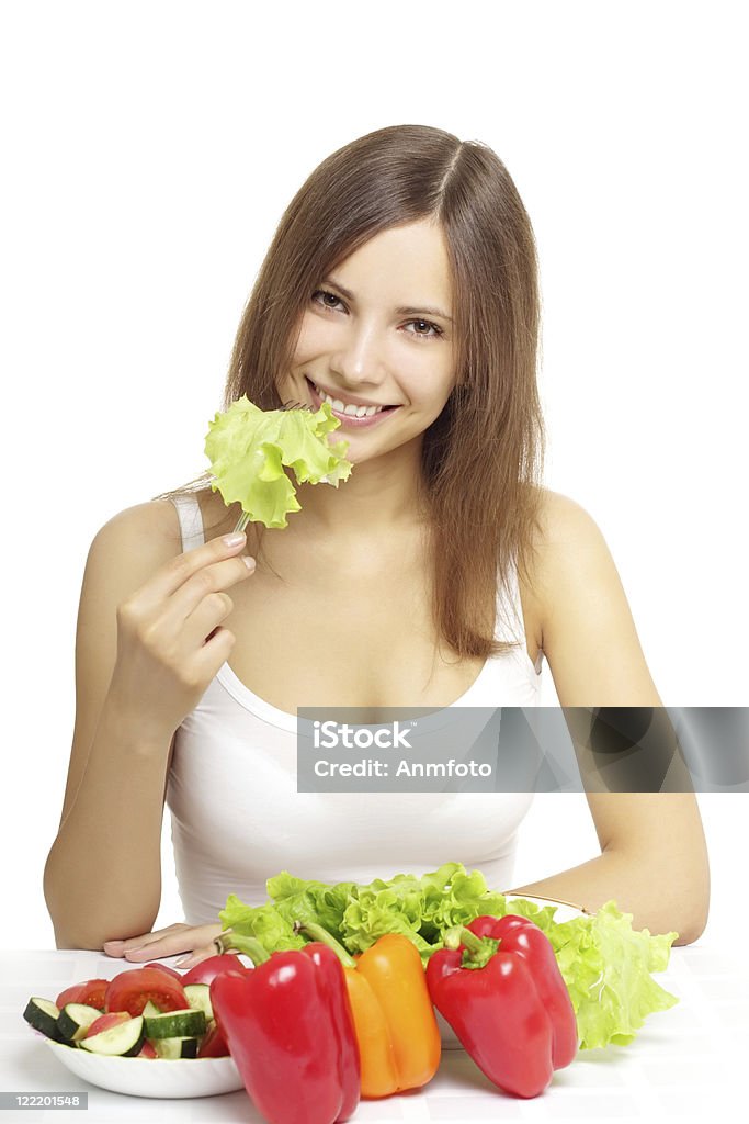 Jeune femme mangeant sain salade sur blanc - Photo de Adolescent libre de droits