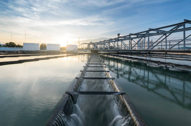 sewage treatment plant with sunrise The Solid Contact Clarifier Tank type Sludge Recirculation process in Water Treatment plant with sunrise sewage treatment plant stock pictures, royalty-free photos & images