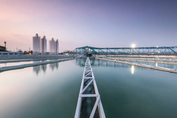 sewage treatment plant with sunrise stock photo