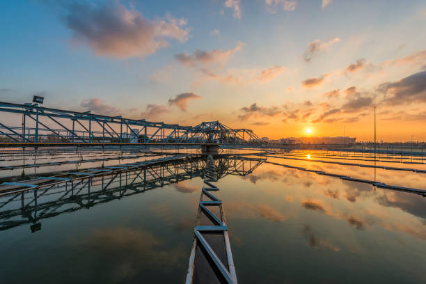 sewage treatment plant with sunrise stock photo
