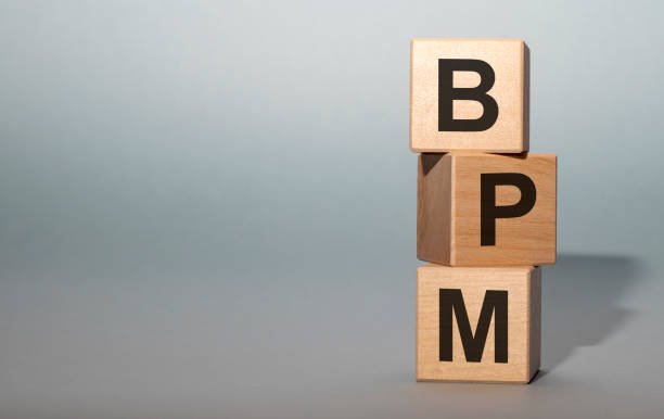 istock Acronym BPM - Business process management. Wooden cubes with letters isolated on grey background with copy space available. Business Concept image. 1222017063