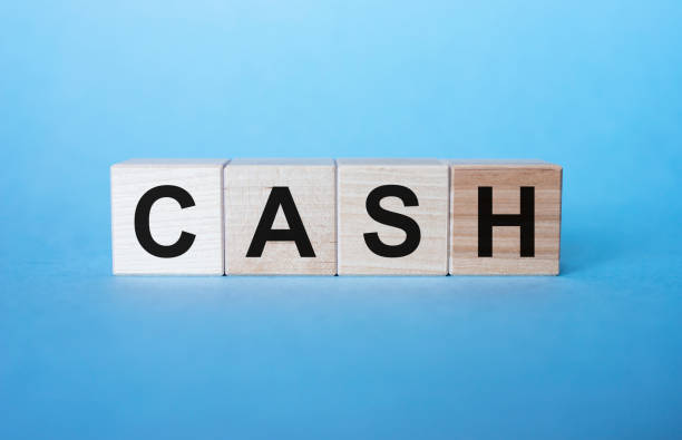 istock CASH word concept on cubes on light blue background 1222017070