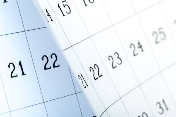 istock Closes a calendar page in blue. flipping calendar 1222017158