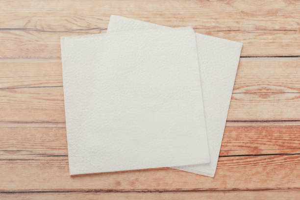 istock white paper napkin or tissue on the wooden table background. 1222017264
