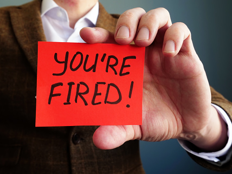 Employer shows phrase You are fired. Wrongful Dismissal concept.