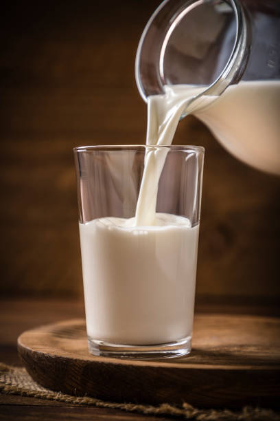 istock Pouring milk into a drinking glass 1222018164