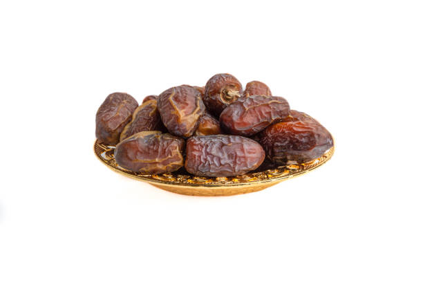 istock Date fruits or dry dates isolated on white background. 1222020514