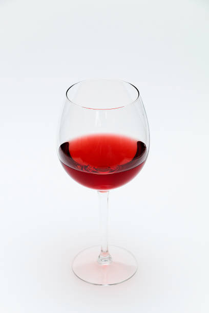 istock Glass of red wine on a white background 1222020812