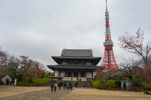 Tokyo, Japan - December 19,2019 : Unidentified people visit Zojo-ji Temple in cloudy day in Tokyo, Japan on December 19,2019.