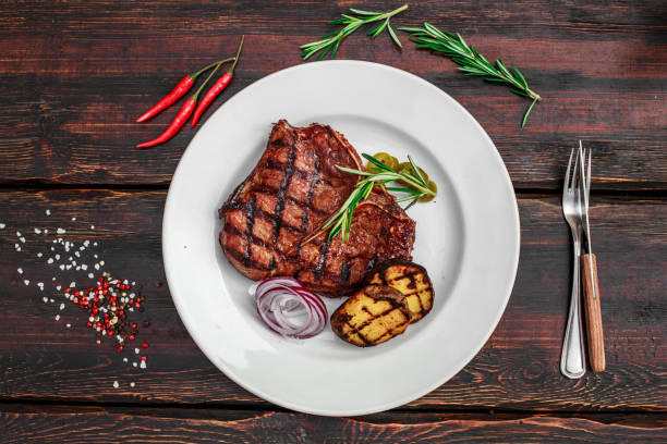 istock A large steak with spices and vegetables on the grill 1222022098