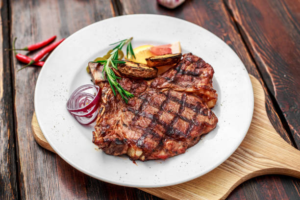 istock A large steak with spices and vegetables on the grill 1222022143