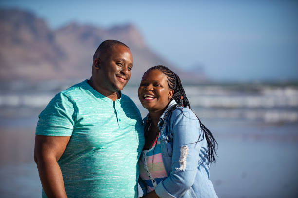 istock Happy beach walk couple smiling 1222023928