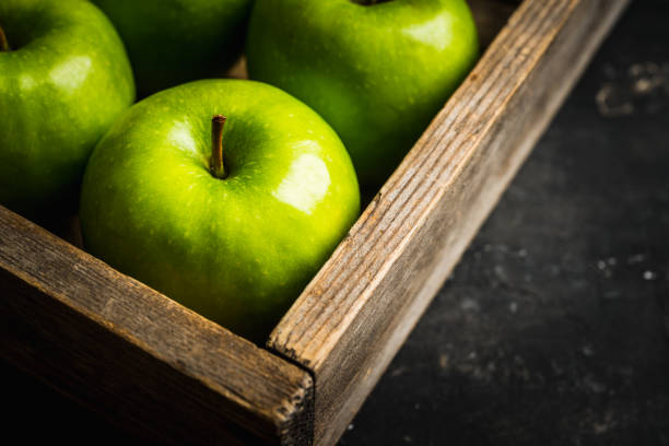 istock Close-up green apples on the rustic wooden background 1222024797
