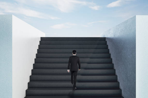 istock Businessman walking on top ladder 1222029167