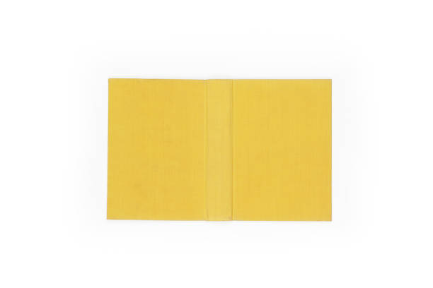 istock Open hard cover yellow book on white background 1222029217