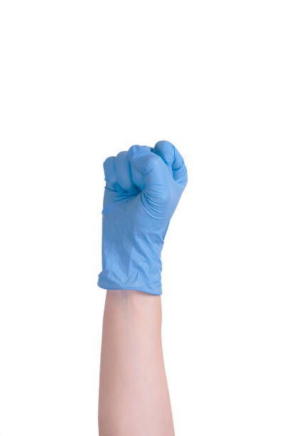 istock blue-gloved hand in a fist. coronavirus pandemics 1222029263