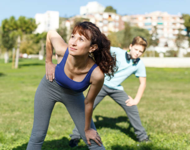 istock Mother and son stretching outdoors 1222029725