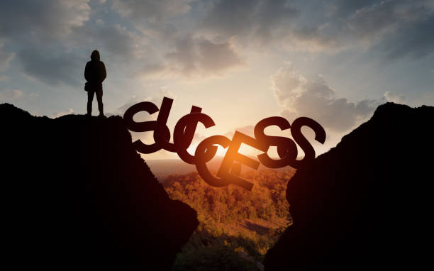 istock Man about to stay over precipice on SUCCESS word bridge 1222031178
