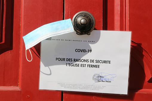 France. Auvergne-Rhône-Alpes. Haute-Savoie. Saint-Gervais-les-Bains. 01/15/2016. This colorful image depicts a poster stating that the church is closed for security reasons. Coronavirus. Covid-19.