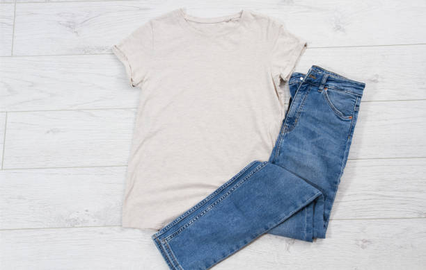 istock T shirt mock up and blue denim background top view 1222035735