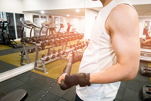 Close up fitness man hand is workout in the gym