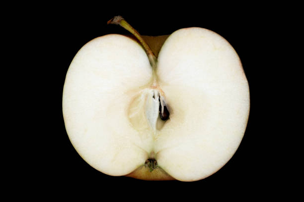 istock seasonal apple in the section with peduncle on a black background 1222040962