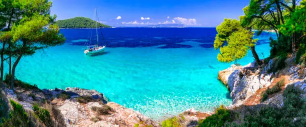 Photo of Best beaches of Skopelos island - Kastani with crystal turquoise sea. Greece, nothen Sporades