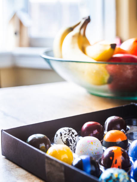 istock Box of artisanal chocolate on wooden table 1222043487