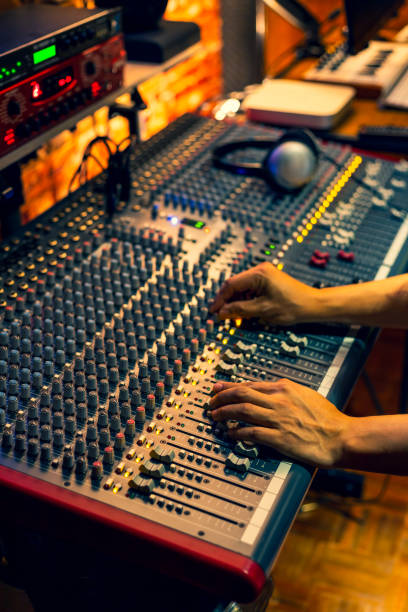 istock male sound engineer hands working on audio mixing console in recording, broadcasting studio 1222044086