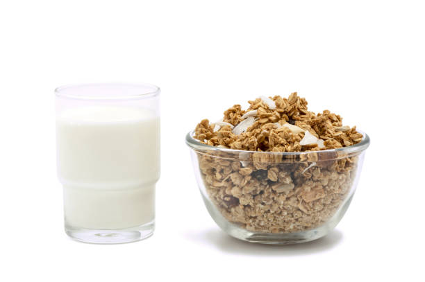 Fresh milk and granola isolated on white background with clipping path