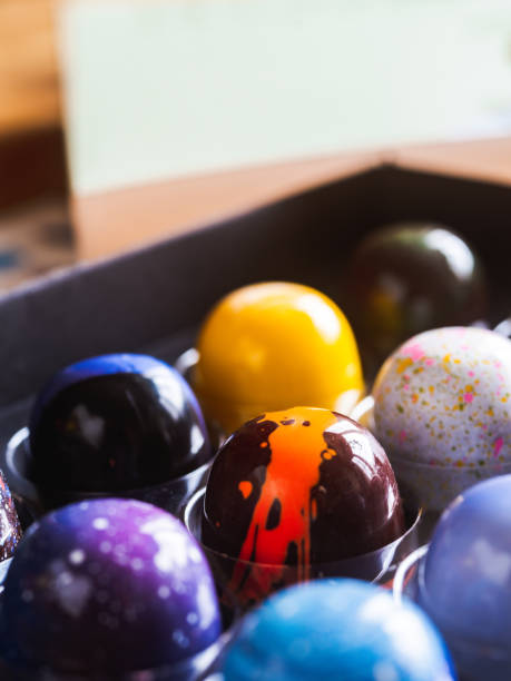 istock Box of artisanal chocolate on wooden table 1222046098