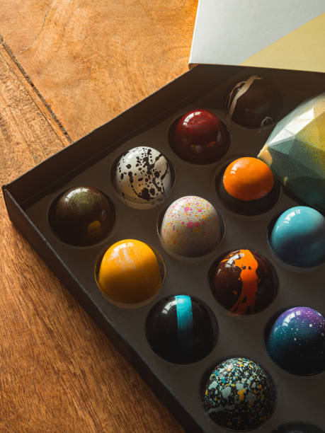 Box of artisanal chocolate on wooden table