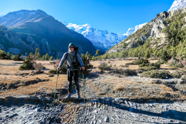 istock Praken Gompa - A man hiking with Annapurna chain behind him 1222047825