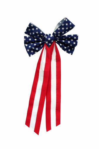 Featuring the stars and stripes, this patriotic felt bow is isolated on white.  