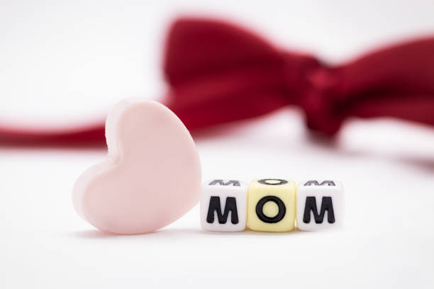 LOVE MOM text word made with colorful blocks and Gift Bow