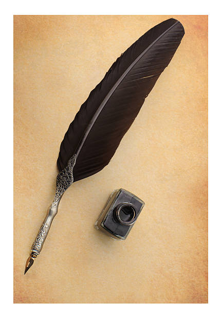 istock Feather quill and inkwell on an old paper 122205347