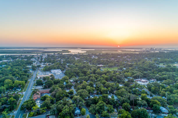 istock Sun Dropping into Horizon Beyond Brunswick, Georgia 1222053748