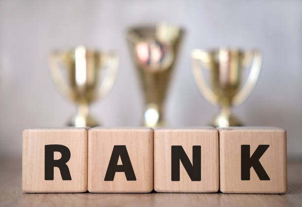 istock Rank text on wooden cubes on a table with cups 1222057693