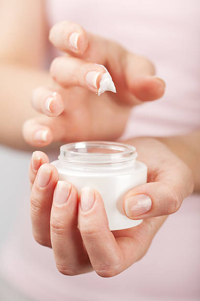 istock beautiful woman hands with cream 122205989