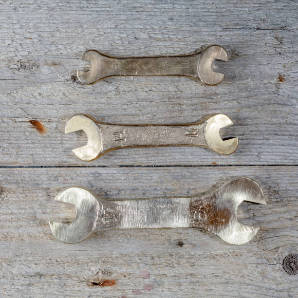 istock old rusty tools, wrenches, spanners, pliers on wood 1222061304