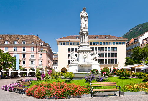 The Fountain with the statue of Walther von der Vogelweide in Bolzano, Italy, created in the year 1889 by Heinrich Natter (1844 - 1892, Austrian sculptor and writer). Walter von der Vogelweide (c. 1170 - c. 1230) is considered the most important German-language poets of the Middle Ages.