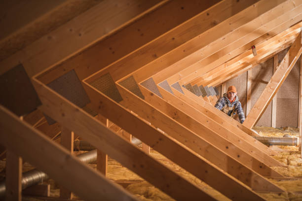 istock Construction Worker Insulating Attic Space Of Home. 1222063483