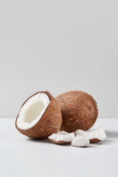 istock Set from natural ripe coconut fruits with half and pieces on a grey background. 1222064792