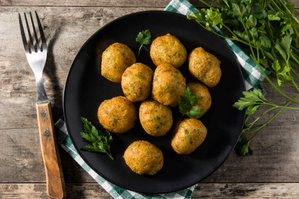 istock Traditional cod fritters decorated with garlic and parsley 1222066485