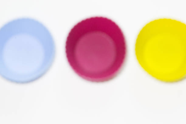istock Set of colors silicon moulds for baking muffins on the white background 1222066507