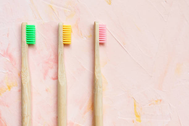 istock Natural wooden bamboo toothbrushes on pink 1222066701