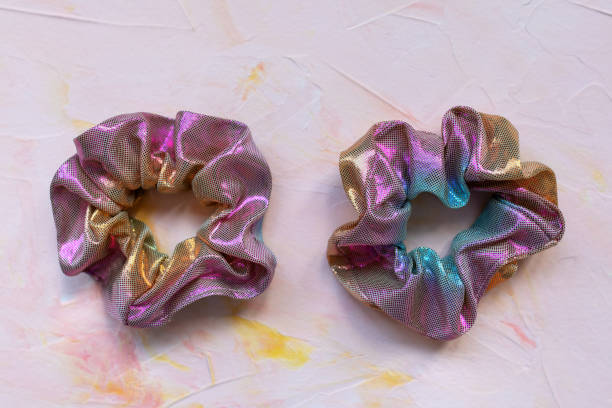 istock Two trendy holographic scrunchies on pink background 1222066715