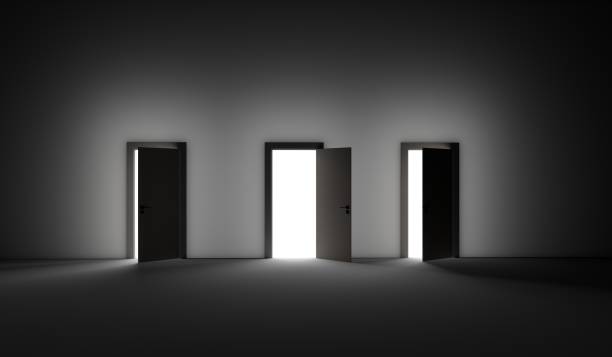 istock An open three door with bright light streaming into a very dark room. 3D rendering illustration 1222066845
