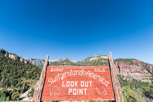 Ouray, USA - September 13, 2019: Small town village wide angle view in Colorado San Juan mountains closeup of sign for Switzerland of America overlook look out point